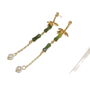 Bamboo style earrings with green gemstones and white pearl drops in gold finish