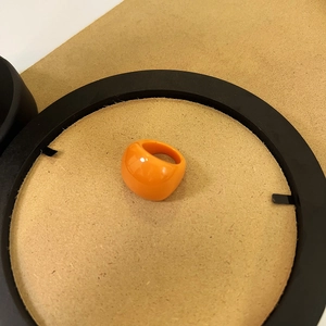 Vibrant orange resin chunky ring with a glossy jelly finish in a minimalist square design