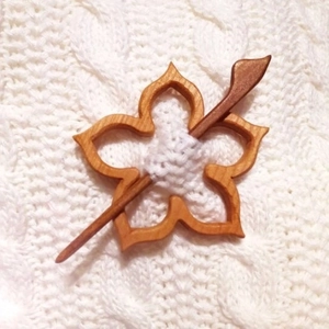 Handcrafted wooden flower shawl pin and brooch with matching stick on white knit fabric