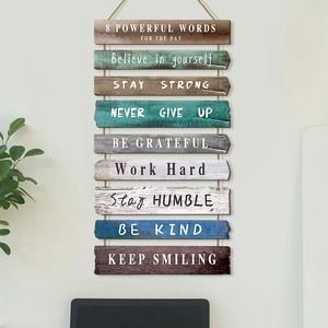 Inspirational wooden wall decor with multi-colored rustic signs and hemp rope hanging