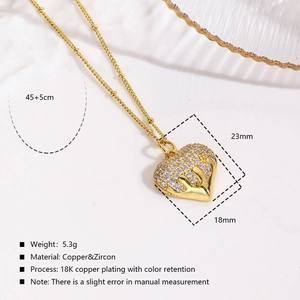 Detail of 18K gold plated heart pendant with zircon inlay and product dimensions