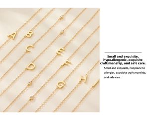 Detailed close-up of gold S925 sterling silver necklaces with zircon letters A to I