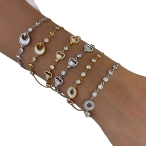 Adjustable sun moon bracelet set with shell inlay and cubic zirconia on model wrist