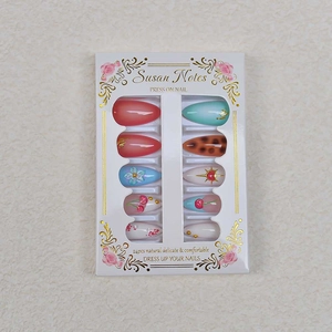 Detail view of 24pcs mixed press-on nails featuring cherry patterns and daisy designs