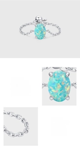 Detailed close-up of oval opal stone in prong setting with 925 sterling silver chain link
