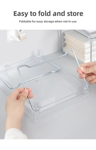 Close-up of the foldable mechanism on this clear acrylic desktop storage shelf