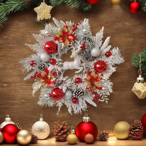 Detailed view of silver frosted Christmas wreath with red ornaments and a silver reindeer