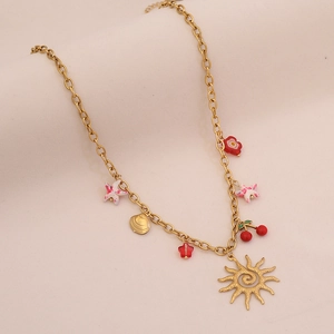 Close-up of colorful gold charms including sun, cherry, flower, and starfish on the necklace