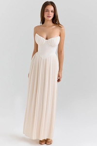 Detailed close-up of cream pleated maxi dress with elegant bustier bodice design