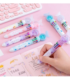 Detail of 10-color shuttle pens featuring butterfly toppers with sequins and stars