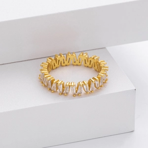 Detailed macro view of gold plated V-shape ring with baguette cut zircon inlay