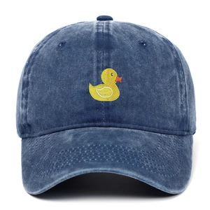 Close-up of yellow duck embroidery on dark blue washed denim baseball cap texture