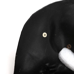 Black studded masquerade mask interior with soft foam padding and secure rivets
