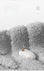 Macro shot of grey high-density absorbent bath mat showing fiber locking texture