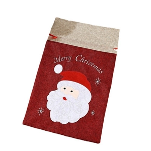 Linen drawstring Christmas gift bag with Santa Claus applique and Merry Christmas text