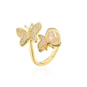 Close-up of 18K gold butterfly ring featuring white zircon and mother of pearl inlay