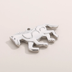 Macro view of polished silver horse pendant showing 3D metallic texture and ring hook