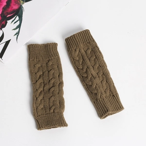 Detailed view of brown cable knit fingerless gloves with soft twisted texture