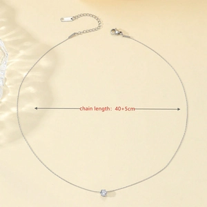 Detailed view of silver titanium steel necklace with a sparkling round zircon pendant