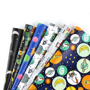 Space exploration themed wrapping paper set with astronauts and rockets on white background