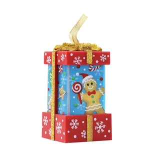 Red and blue Christmas gift box ornament with gingerbread man and gold glitter ribbon