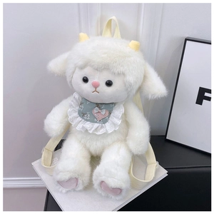 Detail of plush sheep backpack with yellow straps and embroidered heart bib detail