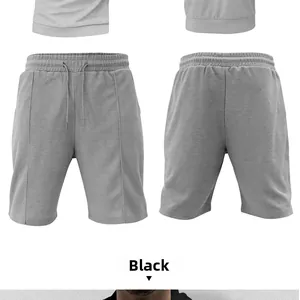 Detail of grey men's waffle knit shorts showing elastic drawstring waist and fabric texture