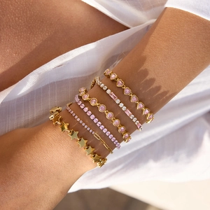 Layered gold titanium steel bracelet set with pink heart zircons and star pendants