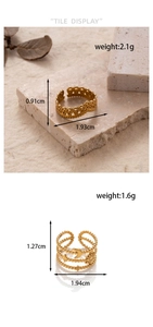 Detail view of gold adjustable rings with crown and celestial charms including dimensions