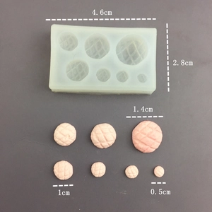 Detailed view of silicone mold and miniature pineapple bun resin results with dimensions