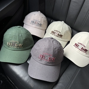 Detail of embroidered bear and lettering on breathable summer cotton baseball caps