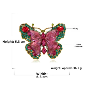 Detailed view of crystal butterfly brooch with size markers 5.3cm height and 6.8cm width