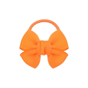Detail view of orange grosgrain ribbon bow hair tie with textured fabric on white background