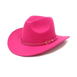 Hot pink wide brim felt cowboy hat with adjustable gold buckle band on white background