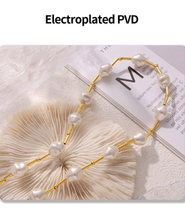 Detail of baroque pearl necklace with PVD 18k gold plated beads on vintage magazine