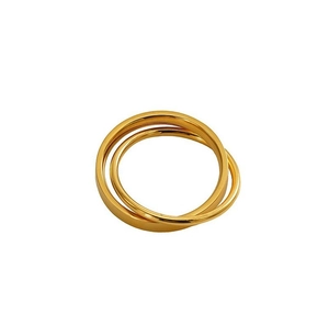 Detailed view of the triple interlocking gold titanium bands with a polished finish