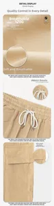Detail of khaki cargo pants showing 170G breathable fabric and drawstring waistband