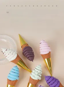 Realistic artificial ice cream cone models with chocolate sprinkles in pastel colors