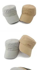 Detail of outdoor military caps in grey and khaki with metal sports letters