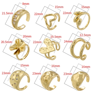 Set of nine diverse 18K gold-plated geometric rings with zircon and open-loop designs