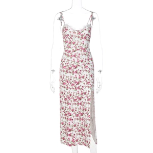 Detail of floral lace neckline and pink rose pattern on white midi slit sundress