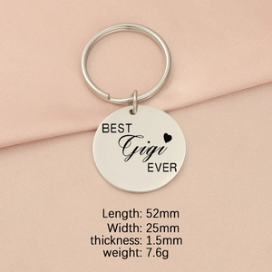 Detailed view of silver stainless steel keychain with BEST Gigi EVER engraving on pink silk