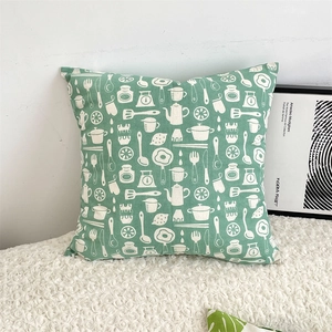 Detailed texture of cotton linen pillow cover with white kitchenware pattern on light green
