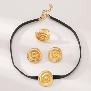 Golden spiral texture jewelry set with necklace, ring and earrings on white background