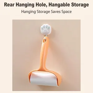 Lint roller with ergonomic orange handle and hanging storage hook for easy space saving