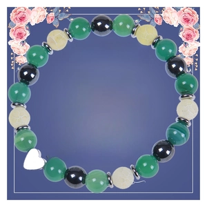 Detail of beaded friendship bracelet with heart charm on a blue Best Friend gift card