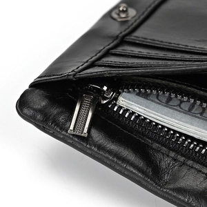 Detail view of premium leather wallet showing precise stitching and multi-card slots