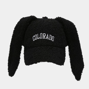Close-up of black teddy fleece bunny hat with white Colorado embroidery and cute ears
