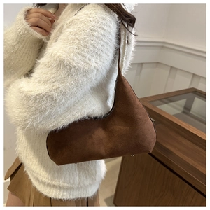Brown frosted suede underarm bag for women with sleek crescent shape and matte finish