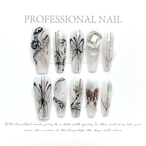 Handmade long press-on nails with black butterfly, ink bamboo, and square crystal decor